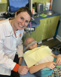 Dr. Bird with a patient