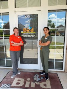Pediatric Dentists, Dr. Bird and Dr. Shekari standing outside of Bird Pediatric Dentistry door